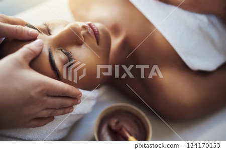 Woman, hands and face massage at spa in relax for skincare beauty treatment on bed at resort. Calm female relaxing with eyes closed or resting in physical therapy, healthy wellness or cosmetic facial Woman, hands and face massage at spa in relax for skincare beauty treatment on bed at resort. Calm female relaxing with eyes closed or resting in physical therapy, healthy wellness or cosmetic facial 134170153