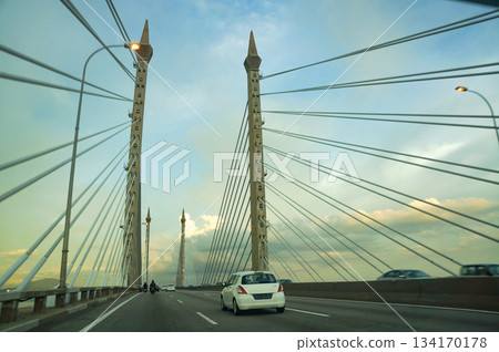 A beautiful sunset seen from the very long bridge over the Penang Straits A beautiful sunset seen from the very long bridge over the Penang Straits 134170178