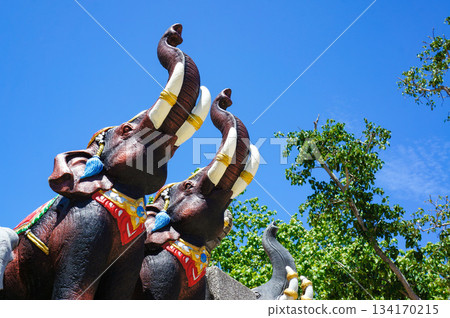 A monument of an elephant with impressive tusks in the square at Promthep Cape 134170215