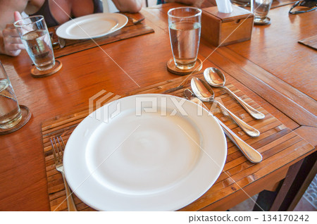 Plates and cutlery set on the table 134170242