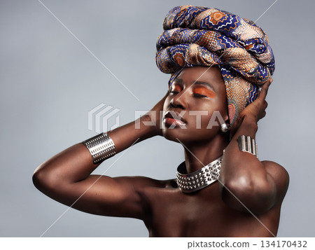 Black woman in traditional turban, fashion and beauty with makeup isolated on studio background. Natural cosmetics, confidence and female model with African head wrap, cosmetic glow and style 134170432