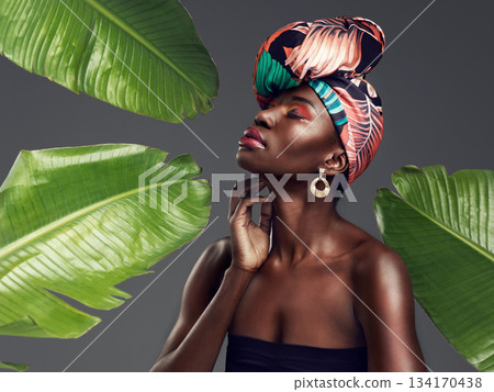 Black woman in African turban, fashion with leaves and beauty with makeup on studio background. Natural cosmetics, nature aesthetic and female model with traditional head wrap, creativity and style Black woman in African turban, fashion with leaves and beauty with makeup on studio background. Natural cosmetics, nature aesthetic and female model with traditional head wrap, creativity and style 134170438