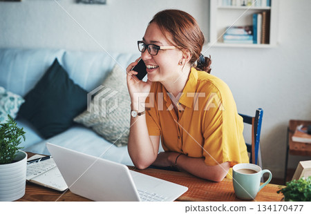 Remote work, phone and woman employee on a call happy about conversation on a cellphone in her home or house. Laptop, freelancer and happy female communication worker working in her apartment Remote work, phone and woman employee on a call happy about conversation on a cellphone in her home or house. Laptop, freelancer and happy female communication worker working in her apartment 134170477