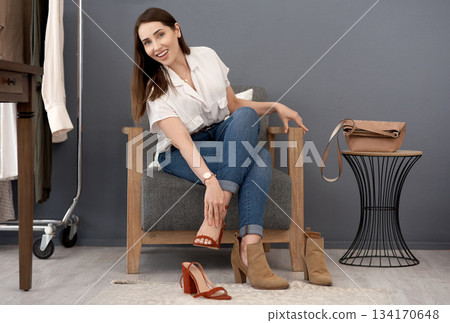 Portrait, store and woman with new shoes, smile and purchase with service, buying or happiness. Female person, customer and girl with boutique items, products or retail with fashion, heels and client Portrait, store and woman with new shoes, smile and purchase with service, buying or happiness. Female person, customer and girl with boutique items, products or retail with fashion, heels and client 134170648