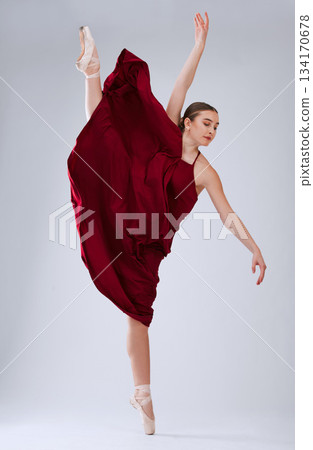 Ballet, talent and woman in studio for training, creative routine and ready for performance, show or artist with movement on grey studio background. Dancer, ballerina or female performer with balance Ballet, talent and woman in studio for training, creative routine and ready for performance, show or artist with movement on grey studio background. Dancer, ballerina or female performer with balance 134170678