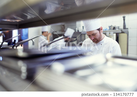 Team, employees and chef in a kitchen, catering and prepare delicious meal with equipment. Professional, coworkers or staff with workspace, utensils or start dinner rush with food industry or cooking 134170777