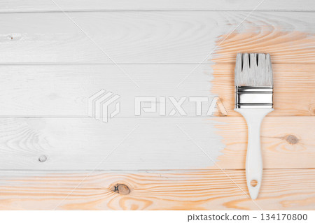 Color of 2026 year dancer in the white cloud. Painting wooden planks white with a brush covering surface 134170800