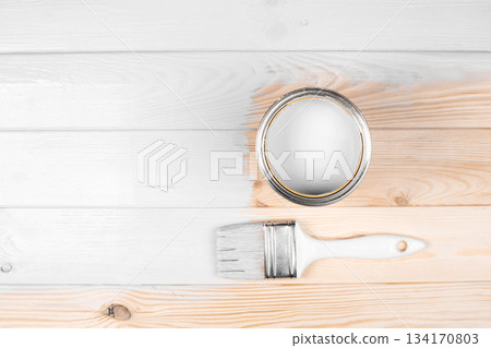 Color of 2026 year dancer in the white cloud. White paint can and brush on wooden surface Color of 2026 year dancer in the white cloud. White paint can and brush on wooden surface 134170803