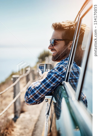 Road trip, travel and man in window of car driving for adventure, summer vacation and holiday. Transportation, relax and face of male person in motor vehicle for freedom, journey and happy by ocean 134170855