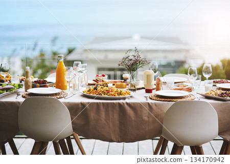 Party, event and table with food, drinks and outdoor for fun, bonding and delicious meal. Chairs, outside and lunch with glasses, juice and social gathering for eating, restaurant and celebration 134170942