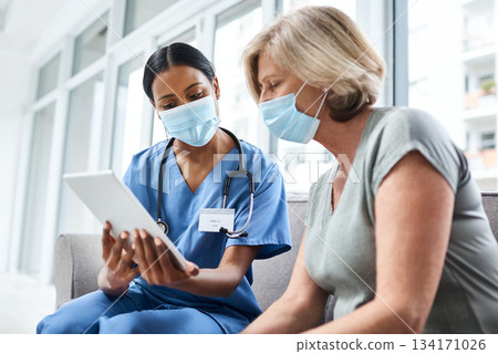 Doctor, senior woman and tablet with mask for covid consultation and digital results. Patient, nurse and tech data with a female person with communication and health insurance information at clinic Doctor, senior woman and tablet with mask for covid consultation and digital results. Patient, nurse and tech data with a female person with communication and health insurance information at clinic 134171026