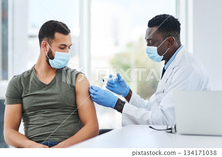 Covid, vaccine and man doctor with syringe in healthcare consultation for safety or prevention. Corona, vaccination and arm injection for guy person by physician in face mask for hospital compliance 134171038