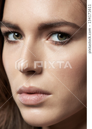 Skincare, closeup and beauty or portrait of a woman with clean facial cosmetics for spa and self care. Makeup, natural face and model person or skin glow treatment or anti aging and eyeliner 134171611