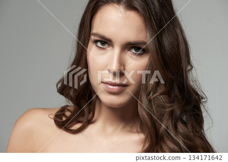 Skincare, beauty and portrait of a woman with natural facial cosmetics or spa and self care on grey background. Makeup, luxury glamour and face of serious model person or skin glow treatment Skincare, beauty and portrait of a woman with natural facial cosmetics or spa and self care on grey background. Makeup, luxury glamour and face of serious model person or skin glow treatment 134171642