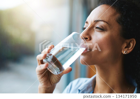 Drinking water, glass and woman thinking of healthcare, wellness and self care at home. Fresh, clean liquid and african person in window of her house with vision for health, diet and nutrition Drinking water, glass and woman thinking of healthcare, wellness and self care at home. Fresh, clean liquid and african person in window of her house with vision for health, diet and nutrition 134171950