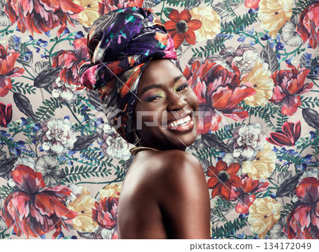 Fashion, beauty and portrait of black woman on flower background with glamour, cosmetics and makeup. Floral pattern, happy and face of female person in exotic jewelry, African style and head scarf 134172049