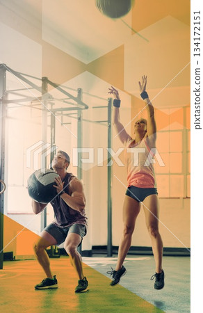Fitness people, jump and medicine ball at gym for exercise, workout and training goals. Athlete man and woman team together for power challenge, energy or strong muscle at wellness club with overlay Fitness people, jump and medicine ball at gym for exercise, workout and training goals. Athlete man and woman team together for power challenge, energy or strong muscle at wellness club with overlay 134172151