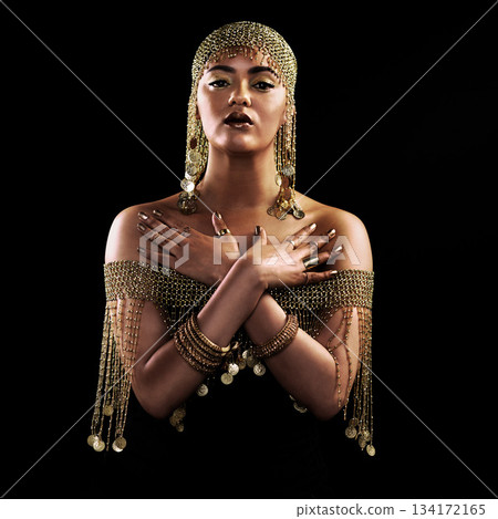 Portrait, fashion and serious woman in studio with jewellery, gold or creative on black background. Face, queen and lady model pose in luxury accessories for cosplay, rich and royal aesthetic Portrait, fashion and serious woman in studio with jewellery, gold or creative on black background. Face, queen and lady model pose in luxury accessories for cosplay, rich and royal aesthetic 134172165