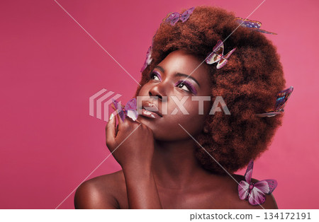 Cosmetic, makeup and black woman with butterflies in a studio with beauty, natural and elegant face. Cosmetics, fantasy and young African female model posing with beautiful insects by pink background 134172191