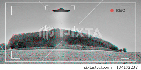 UFO, alien and viewfinder on a camera screen to record a flying saucer in the sky over area 51. Camcorder, sighting and conspiracy with a spaceship on a recording device display outdoor in nature UFO, alien and viewfinder on a camera screen to record a flying saucer in the sky over area 51. Camcorder, sighting and conspiracy with a spaceship on a recording device display outdoor in nature 134172238