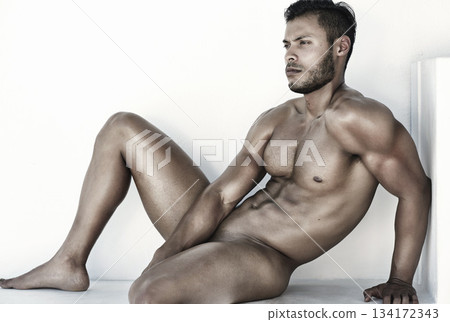 Body, nude man for art posing and sitting in white background for sexy health. Artistic expression or freedom, skincare and strong or naked male model with a pose for artwork or sexuality 134172343