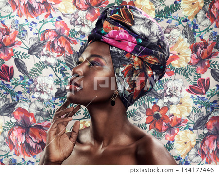 Black woman in African turban, fashion on flower background and beauty, makeup with floral aesthetic. Natural cosmetics, profile and female model in traditional head wrap with creativity and style Black woman in African turban, fashion on flower background and beauty, makeup with floral aesthetic. Natural cosmetics, profile and female model in traditional head wrap with creativity and style 134172446