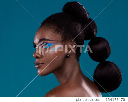 Thinking, hair and makeup with a model black woman in studio on a blue background for beauty. Idea, haircare and cosmetics with an attractive young female person at the salon for fashion or styling 134172470