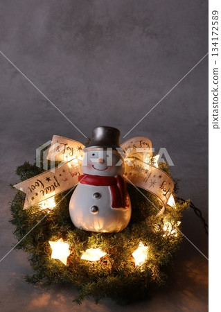 Lighted Christmas wreath and snowman Lighted Christmas wreath and snowman 134172589
