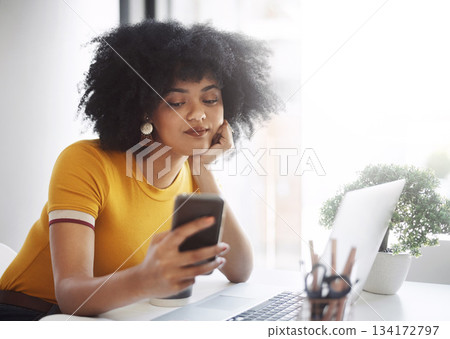 Phone, laptop and bored business woman on social media, browse or texting while working on report or email. Phone, search and female office worker online waiting for text, message or notification 134172797