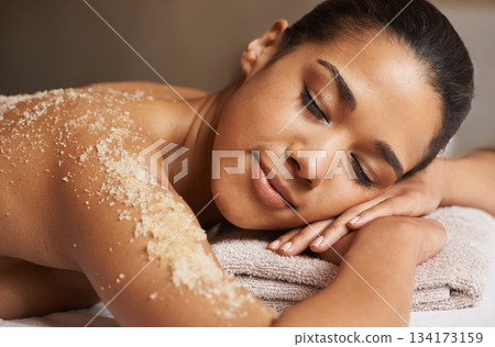Woman, body scrub or back massage in spa to relax for zen, sleeping or wellness physical therapy in resort. Relaxed girl client in salon to exfoliate for luxury skincare treatment or beauty therapy 134173159