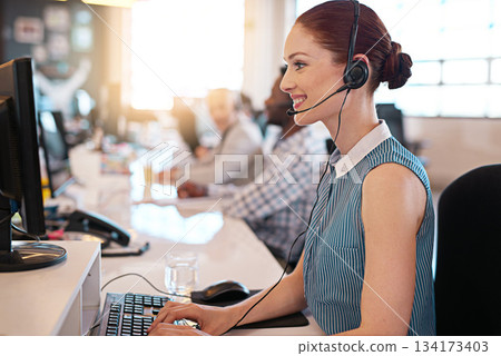 Call center, telemarketing and woman doing an online consultation in a office with a headset. Crm strategy, contact us and female customer support representative working on computer in the workplace. Call center, telemarketing and woman doing an online consultation in a office with a headset. Crm strategy, contact us and female customer support representative working on computer in the workplace. 134173403