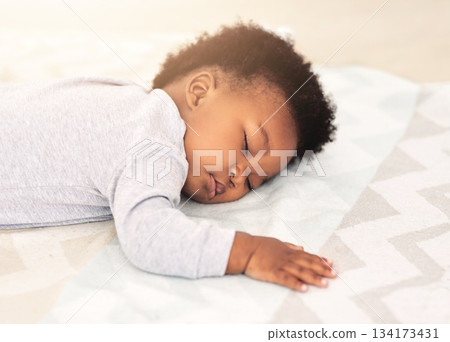 Baby, african boy and sleeping on bed for rest, health and peace for growth, development and relax in family home. Black male infant, tired and sleep in bedroom with fatigue, quiet and calm in house Baby, african boy and sleeping on bed for rest, health and peace for growth, development and relax in family home. Black male infant, tired and sleep in bedroom with fatigue, quiet and calm in house 134173431