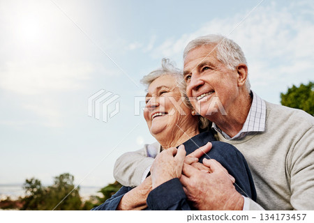Sky, elderly couple and hug outdoors or happy in retirement or husband and wife in nature. Mature, man and woman smile in vacation or senior citizens care and embrace or date at the park for romance Sky, elderly couple and hug outdoors or happy in retirement or husband and wife in nature. Mature, man and woman smile in vacation or senior citizens care and embrace or date at the park for romance 134173457