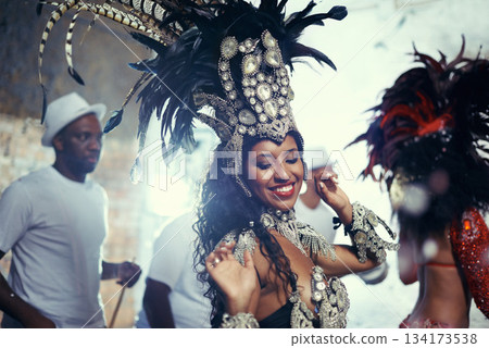 Festival, carnival dancer and woman smile with music and social celebration in Brazil. Mardi gras, dancing and culture event costume with a young female person with happiness from performance 134173538