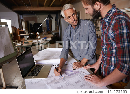 Architect men, teamwork and planning blueprint with discussion, construction goal or vision in workshop. Senior man, young male partner and paperwork for building, property or real estate development Architect men, teamwork and planning blueprint with discussion, construction goal or vision in workshop. Senior man, young male partner and paperwork for building, property or real estate development 134173563