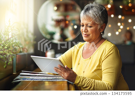 Restaurant, tablet and senior woman typing, research or search internet, web or online website for cafe information. Customer experience, store feedback or elderly female client in retail coffee shop Restaurant, tablet and senior woman typing, research or search internet, web or online website for cafe information. Customer experience, store feedback or elderly female client in retail coffee shop 134173595