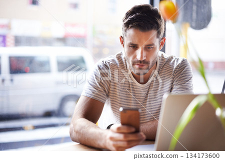 Phone, laptop or man in cafe reading news on social media for an update on the stock market for trading. Coffee shop, entrepreneur or trader texting on mobile app or networking on internet or website Phone, laptop or man in cafe reading news on social media for an update on the stock market for trading. Coffee shop, entrepreneur or trader texting on mobile app or networking on internet or website 134173600