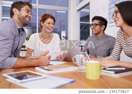 Team laughing together, creative people in meeting with collaboration and project planning in conference room. Brainstorming, teamwork with young men and women in strategy discussion in workplace 134173627