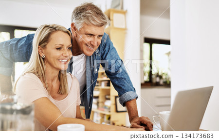 Mature couple, smile and laptop research at home with happiness and computer. Email, online banking and life insurance of a woman and man together in a house planning finance budget for retirement Mature couple, smile and laptop research at home with happiness and computer. Email, online banking and life insurance of a woman and man together in a house planning finance budget for retirement 134173683