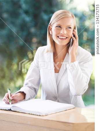 Phone call, receptionist and woman taking notes at hotel, writing and thinking at reception. Smile, notebook and female secretary with cellphone for reservation, appointment and booking at spa. Phone call, receptionist and woman taking notes at hotel, writing and thinking at reception. Smile, notebook and female secretary with cellphone for reservation, appointment and booking at spa. 134173755
