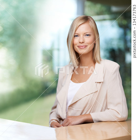 Portrait, mockup and professional with a business woman at a desk in her office for company vision. Confident, happy and success with a young female employee looking ambitious while sitting at work Portrait, mockup and professional with a business woman at a desk in her office for company vision. Confident, happy and success with a young female employee looking ambitious while sitting at work 134173763