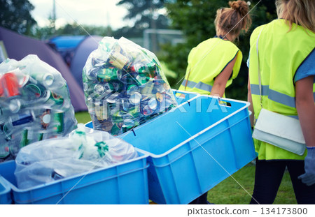 Recycling, community service and volunteer work outdoor with cans and garbage at a park. Cleaning, sustainability and bottle recycle with people helping with rubbish and pollution for environment 134173800
