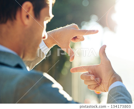 Hand, frame and business man in city for vision, focus and thinking with mockup. Inspiration, planning and idea with male employee and finger gesture in outdoors for freedom, motivation and insight 134173803