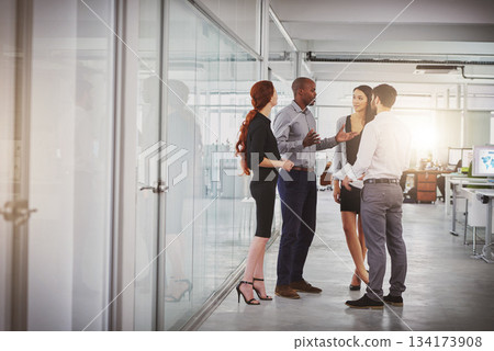 Business people, group and discussion in office hallway with men, women or diversity for strategy at startup. Businessman, leader or talking for motivation, teamwork or brainstorming for company goal Business people, group and discussion in office hallway with men, women or diversity for strategy at startup. Businessman, leader or talking for motivation, teamwork or brainstorming for company goal 134173908