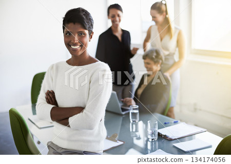 Confidence, leader and portrait of a woman in a business meeting in a modern corporate office. Happy, success and professional Indian female manager standing with crossed arms in workplace boardroom Confidence, leader and portrait of a woman in a business meeting in a modern corporate office. Happy, success and professional Indian female manager standing with crossed arms in workplace boardroom 134174056