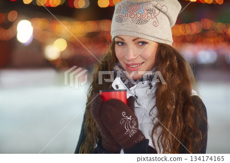 Portrait, winter and woman with a coffee, smile and relax with cold, warmth and chilling. Face, female person and happy model with tea, blurry background and happiness with cappuccino and joyful Portrait, winter and woman with a coffee, smile and relax with cold, warmth and chilling. Face, female person and happy model with tea, blurry background and happiness with cappuccino and joyful 134174165