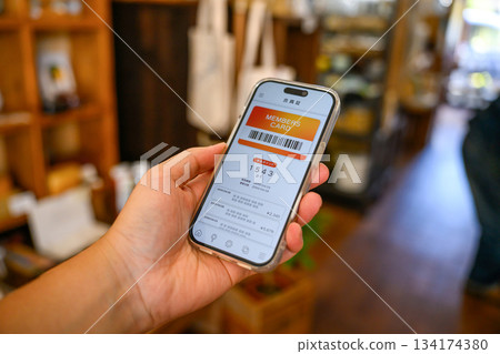 Present your smartphone membership card 134174380