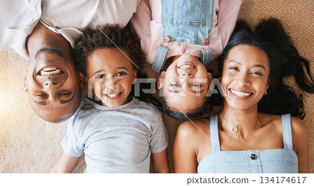 Family, portrait and top view smile in house, bonding or having fun together. Parents, happiness above and children relaxing or lying on carpet floor with man and woman, care or enjoying quality time Family, portrait and top view smile in house, bonding or having fun together. Parents, happiness above and children relaxing or lying on carpet floor with man and woman, care or enjoying quality time 134174617
