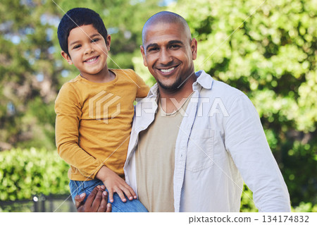 Portrait, son and father with a smile, outdoor and bonding with happiness, family and cheerful. Face, parent and dad with boy, love or embrace in nature, outside and affection with joy, park or relax 134174832
