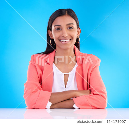 Confident, leader and portrait of business woman with smile feeling happy isolated in a studio blue background. Confidence, young and Indian female corporate proud with arms crossed in backdrop 134175007